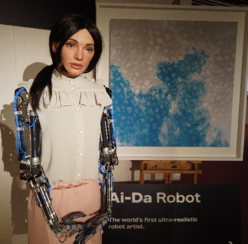 Aida lennymur AiDa the robot standing next to her painting