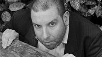 Ed Gaughan Ed Gaughan - actor peering over a piece of wood