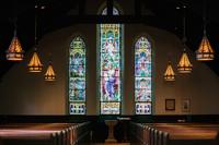 Karl fredrickson jrszwmrd ws unsplash Stained glass window in dark church